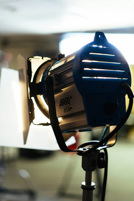 Professional studio lighting equipment with blue casing and silver accents.